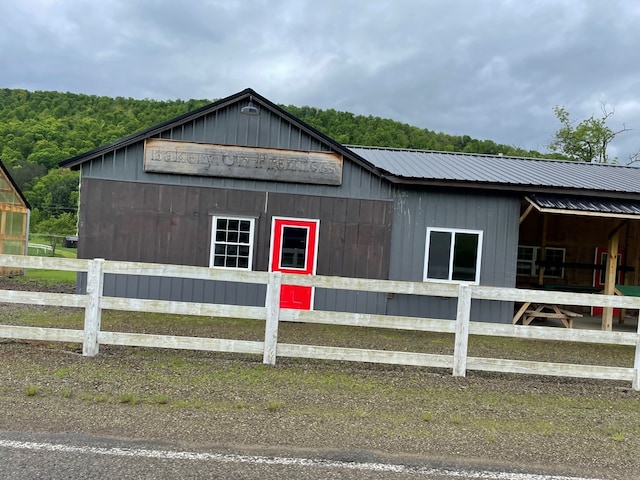 1571 State Route 44n, Coudersport, PA 16915 - view of home's exterior with an exterior structure, an outdoor structure, metal roof, and a view of trees