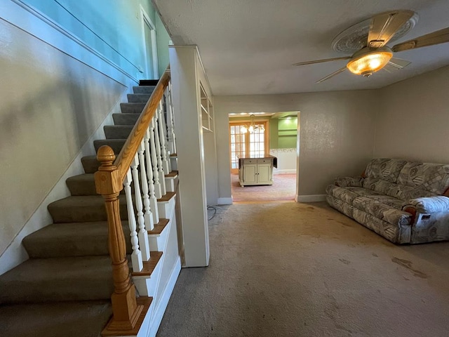 1571 State Route 44n, Coudersport, PA 16915 - carpeted living area featuring stairs, a ceiling fan, and baseboards