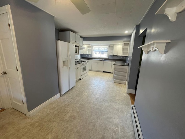 1571 State Route 44n, Coudersport, PA 16915 - kitchen with white appliances, baseboard heating, dark countertops, a sink, and white cabinetry