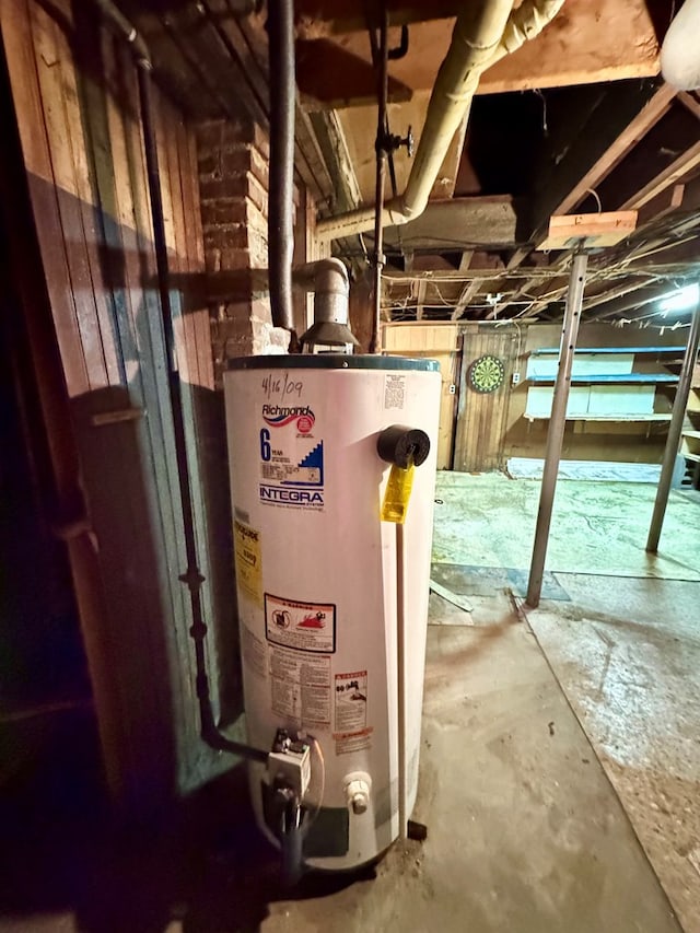 utility room with gas water heater