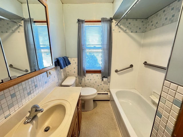 bathroom featuring vanity, toilet, tile walls, and a baseboard heating unit