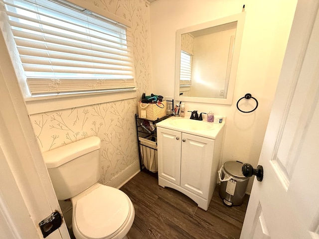 bathroom featuring hardwood / wood-style floors, vanity, toilet, and plenty of natural light