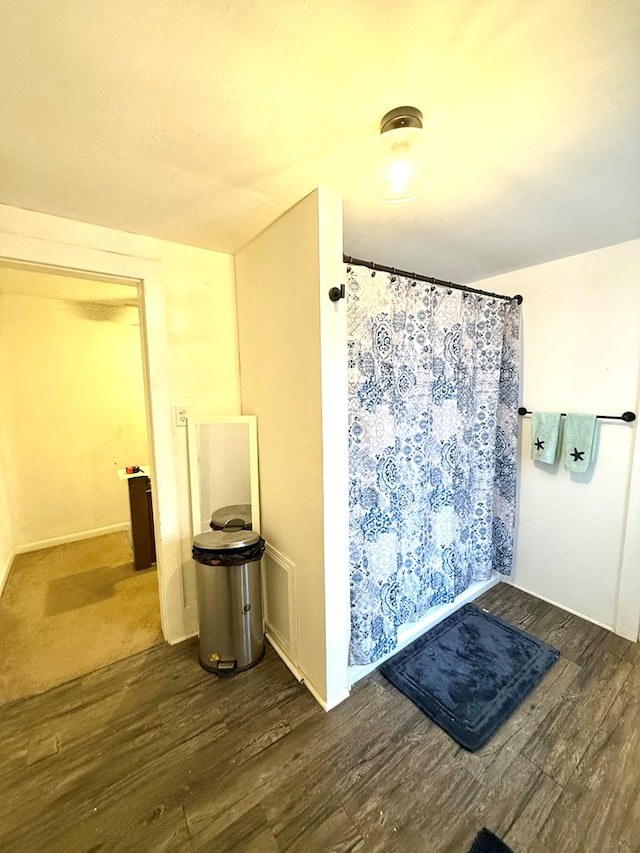 bathroom with wood-type flooring