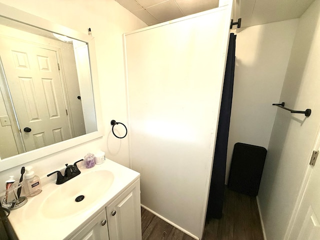 bathroom featuring hardwood / wood-style floors and vanity