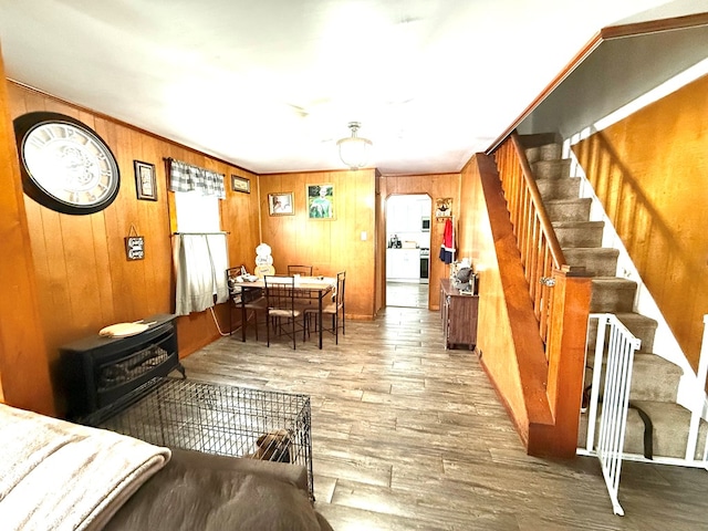 living room featuring wood walls and wood-type flooring