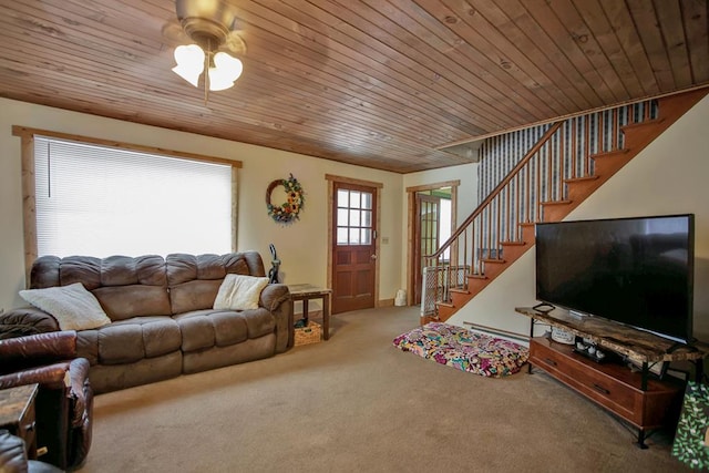 carpeted living room featuring ceiling fan, wooden ceiling, and a baseboard heating unit