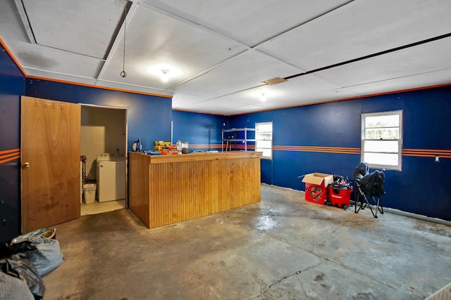 interior space featuring washer / dryer and concrete flooring