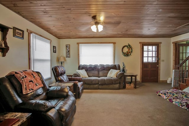 living room with ceiling fan, wood ceiling, and carpet floors