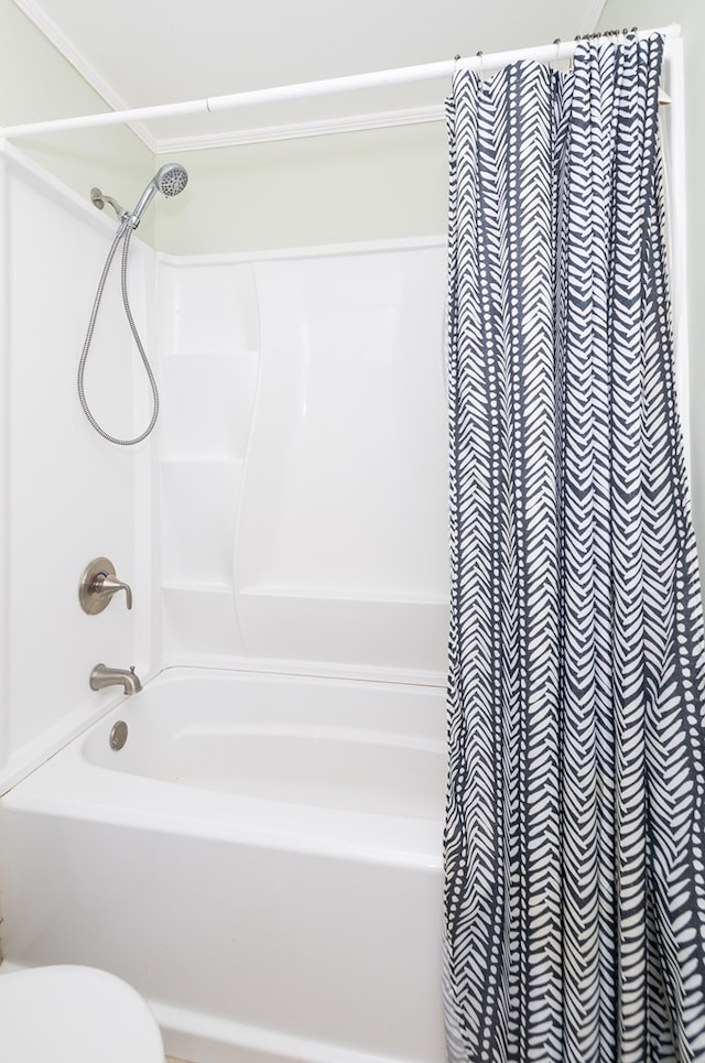 full bathroom with toilet and shower / tub combo