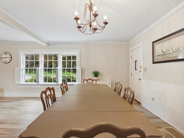 17800 Rte 6, Towanda, PA 18848 - dining space with wood finished floors, a chandelier, ornamental molding, and wainscoting