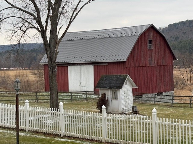 view of front of property featuring an outbuilding and a mountain view