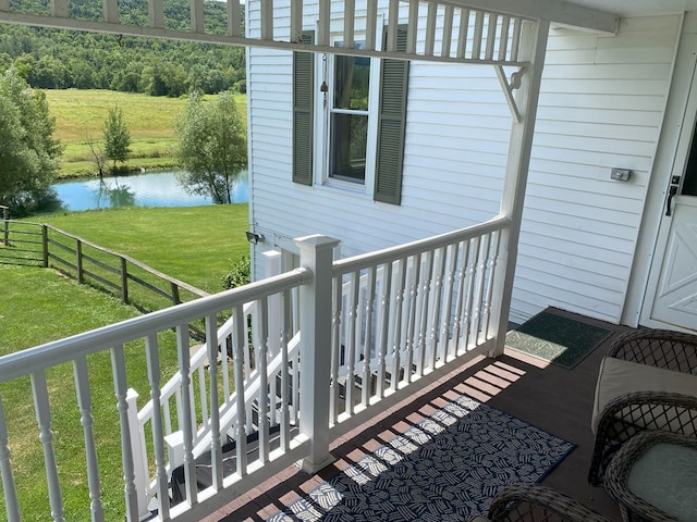 balcony with a deck with water view