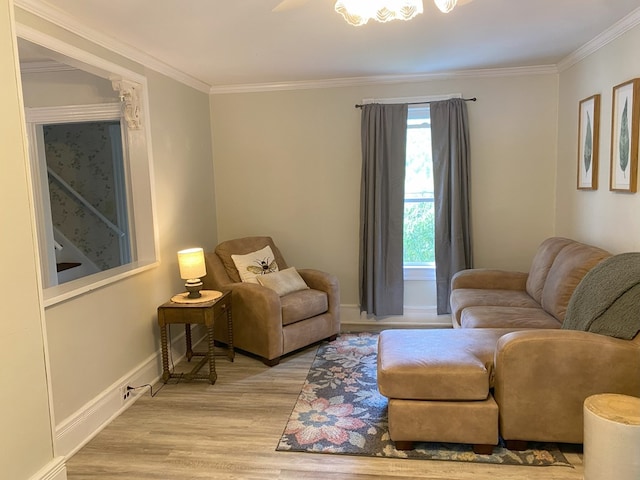 living room featuring ornamental molding and light hardwood / wood-style floors