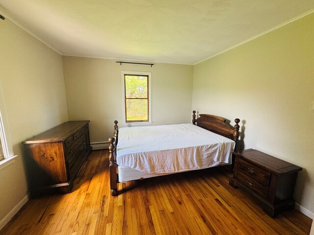 425 Gateway Industrial Park Rd, Athens, PA 18810 - bedroom with a baseboard radiator, ornamental molding, baseboards, and wood finished floors