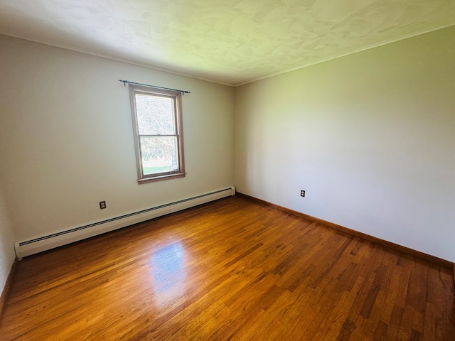 425 Gateway Industrial Park Rd, Athens, PA 18810 - unfurnished room with a baseboard radiator, baseboards, and wood finished floors