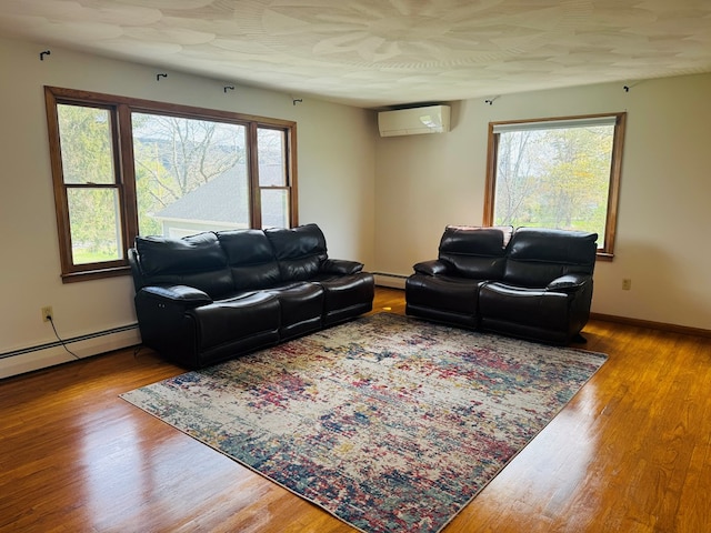 425 Gateway Industrial Park Rd, Athens, PA 18810 - living room with baseboards, wood finished floors, a baseboard radiator, and a wall unit AC