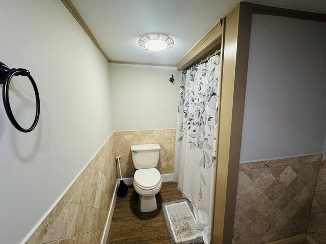 425 Gateway Industrial Park Rd, Athens, PA 18810 - bathroom with toilet, a shower with curtain, a wainscoted wall, tile walls, and ornamental molding