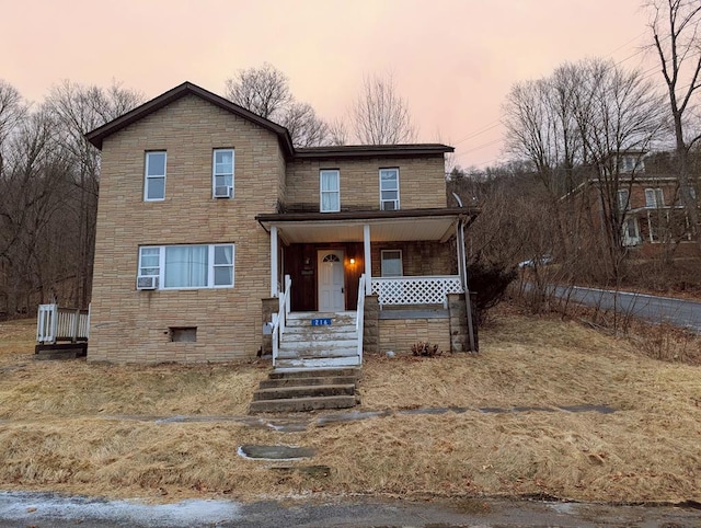 view of front property featuring a porch