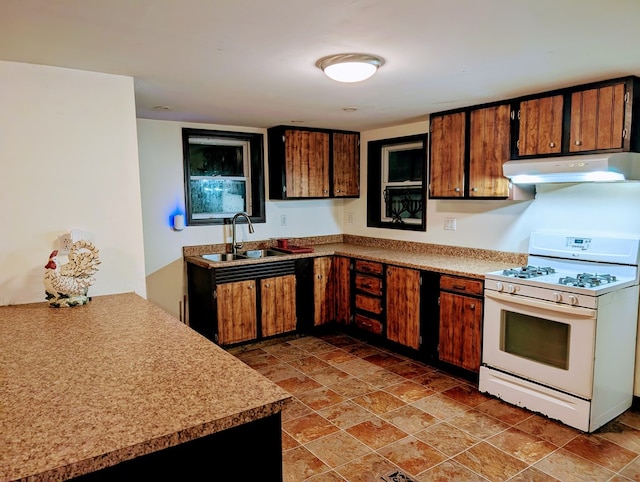 kitchen featuring sink and white gas range oven