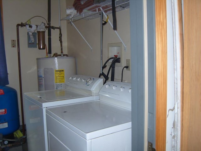 484 French Hill Rd, Middlebury Center, PA 16935 - clothes washing area featuring washing machine and dryer, electric water heater, and laundry area