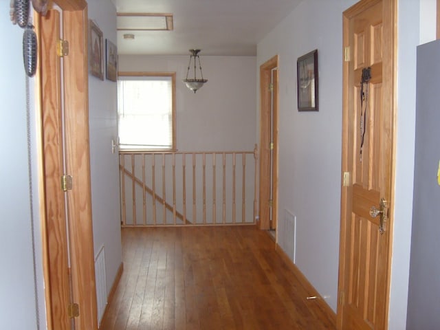 484 French Hill Rd, Middlebury Center, PA 16935 - hall with hardwood / wood-style flooring, visible vents, and an upstairs landing