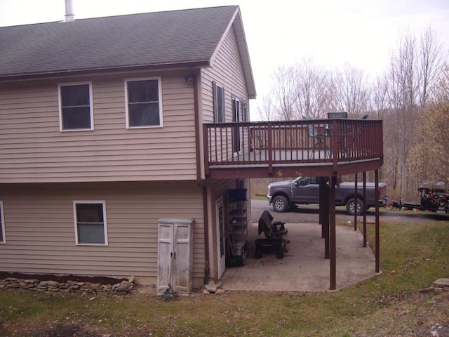 484 French Hill Rd, Middlebury Center, PA 16935 - back of property with a shingled roof, a wooden deck, a lawn, and a patio area
