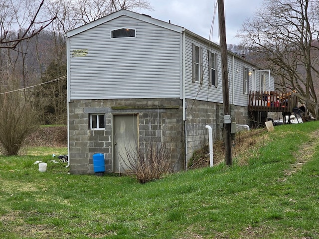 296 Low St, Shinglehouse, PA 16748 - view of side of home with a lawn and a wooden deck