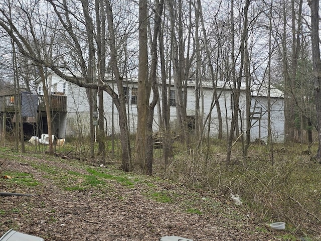 296 Low St, Shinglehouse, PA 16748 - view of yard featuring a deck with water view