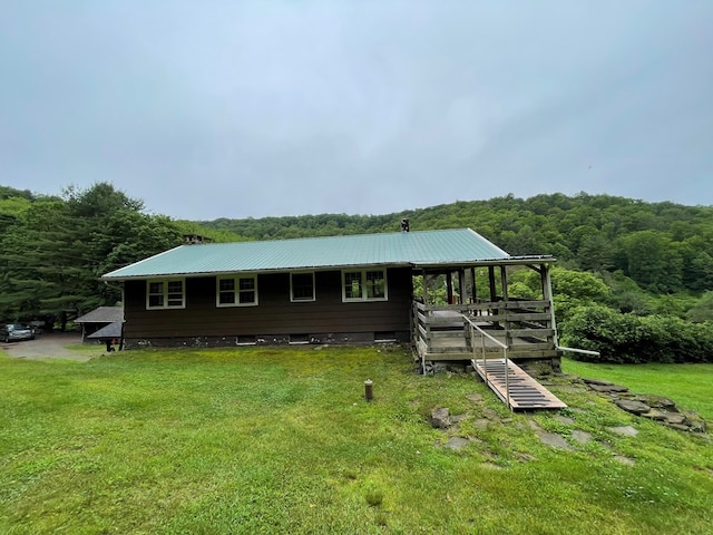 286 Hidden Hollow Farm Dr, Austin, PA 16720 - rear view of house featuring a forest view, a yard, and a metal roof