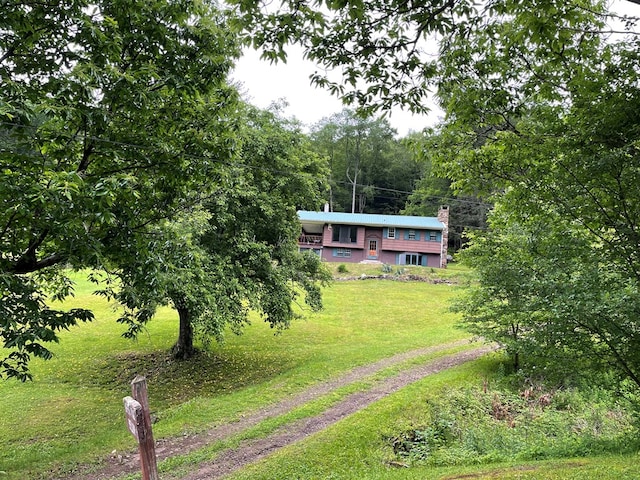 286 Hidden Hollow Farm Dr, Austin, PA 16720 - view of front of house featuring a front yard and a chimney