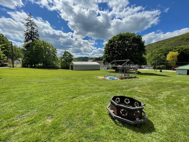 115 Pine St, Galeton, PA 16922 - view of green lawn with an outbuilding