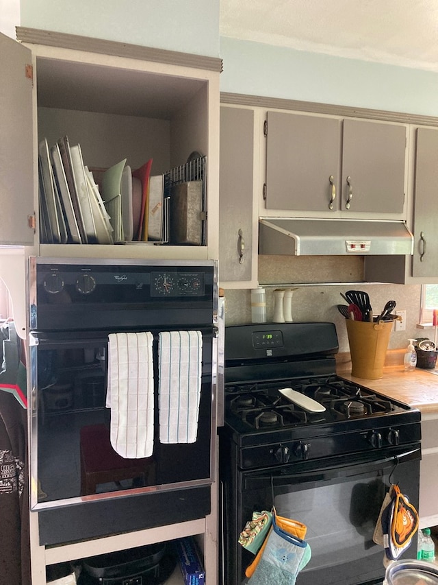 115 Pine St, Galeton, PA 16922 - kitchen with black appliances, range hood, and light countertops