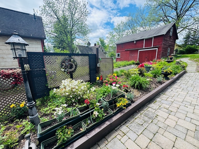 gate with a vegetable garden and an outdoor structure