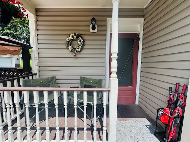 doorway to property featuring a porch