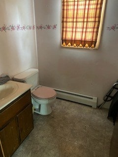 bathroom featuring vanity, toilet, and a baseboard radiator