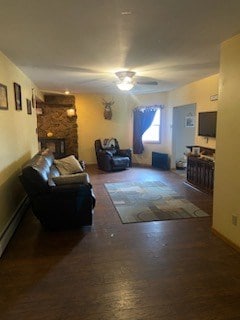 living room featuring ceiling fan, hardwood / wood-style floors, and a baseboard radiator