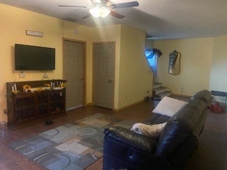 living room with hardwood / wood-style floors and ceiling fan