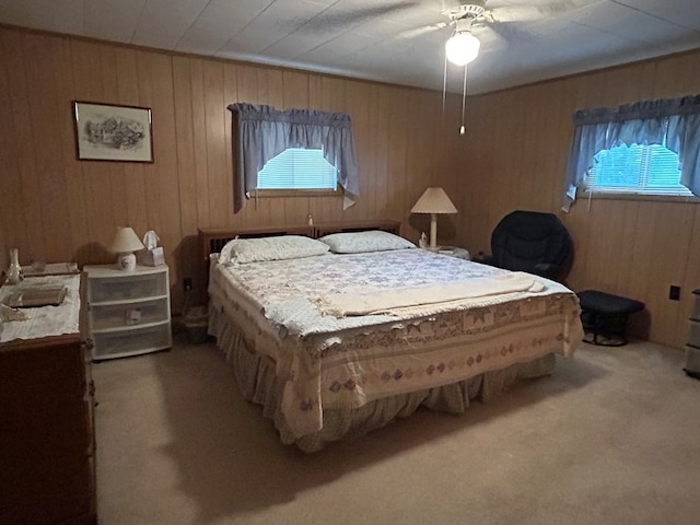 408 S E St, Coudersport, PA 16915 - bedroom featuring carpet floors, multiple windows, wooden walls, and a ceiling fan