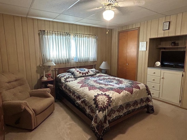 408 S E St, Coudersport, PA 16915 - bedroom with light carpet, wood walls, and a ceiling fan
