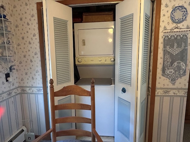 408 S E St, Coudersport, PA 16915 - laundry area with wallpapered walls, estacked washer and dryer, a baseboard heating unit, and a wainscoted wall