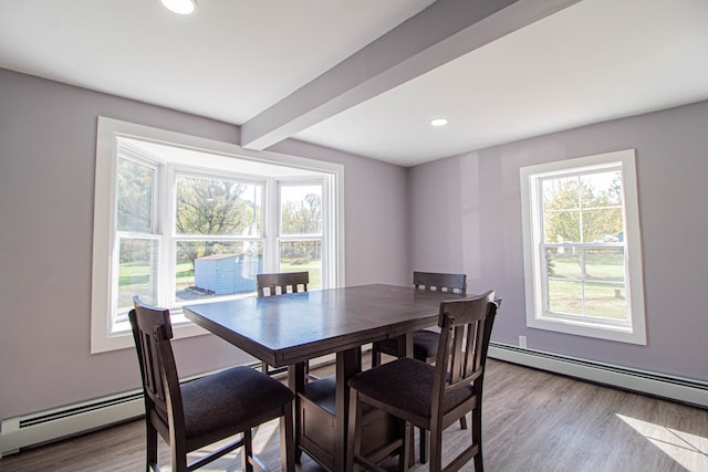 dining room featuring beam ceiling, light hardwood / wood-style floors, and baseboard heating