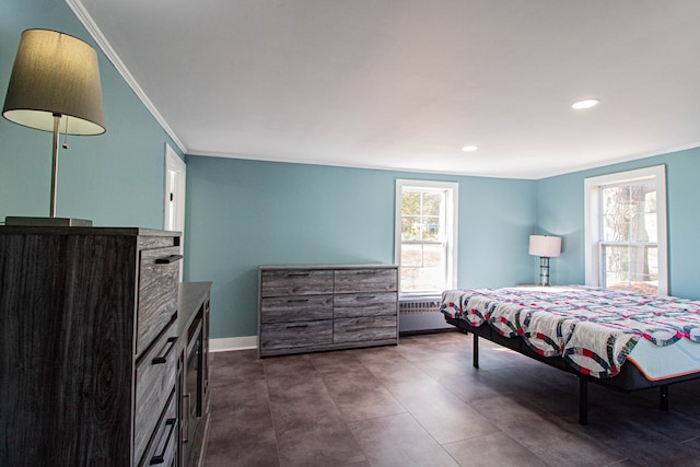 bedroom with radiator heating unit and ornamental molding