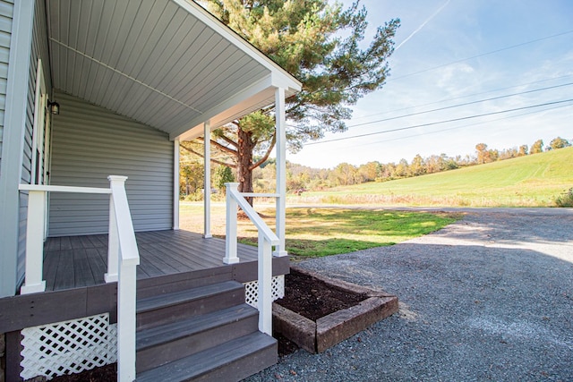 wooden deck with a lawn