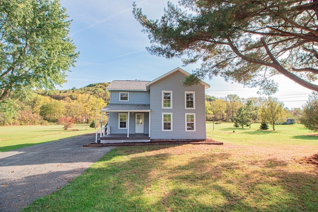 view of front property with a front yard and a porch