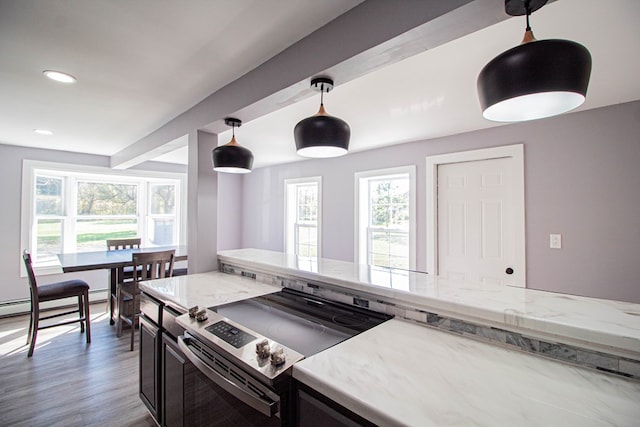 kitchen featuring pendant lighting, stainless steel range with electric stovetop, dark hardwood / wood-style floors, light stone countertops, and baseboard heating