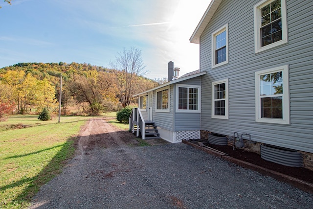 view of side of property featuring a yard