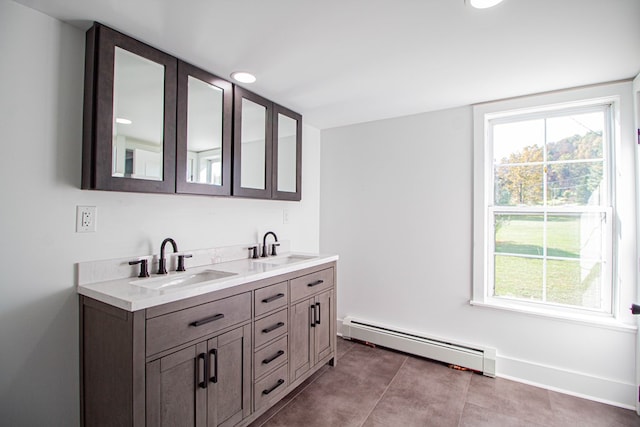 bathroom with vanity and a baseboard radiator