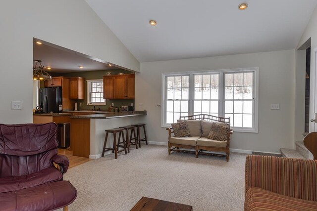 6270 Wolf Run Rd, Campbell-Savona, NY 14821 - living room with vaulted ceiling, light colored carpet, recessed lighting, baseboards, and a chandelier