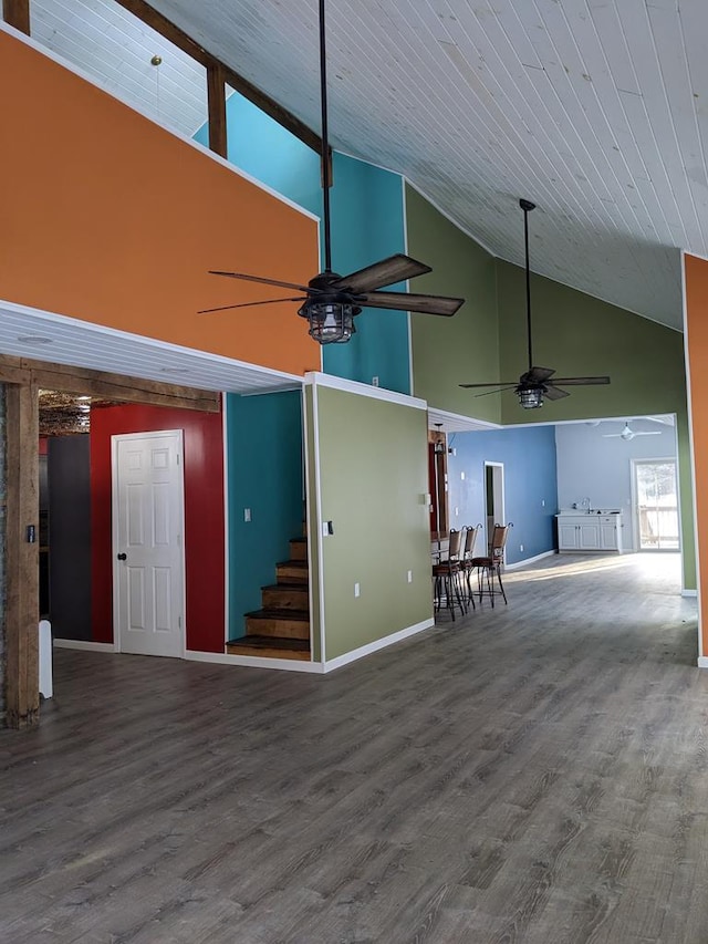 unfurnished living room featuring sink, wood-type flooring, and ceiling fan