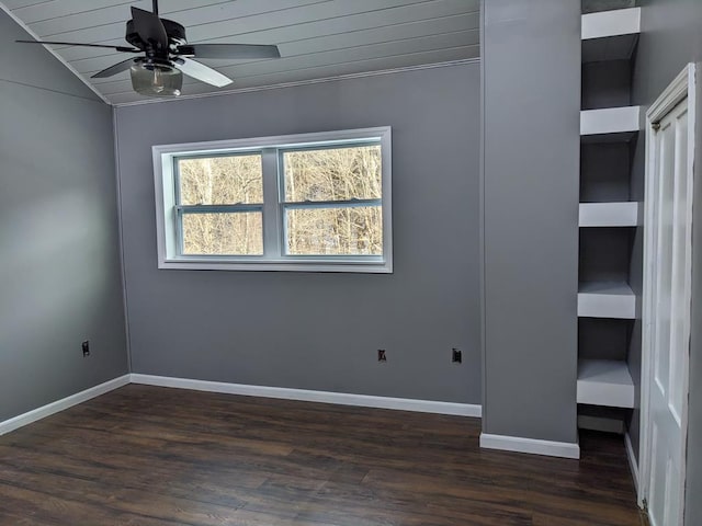 unfurnished room featuring lofted ceiling, dark hardwood / wood-style floors, and ceiling fan